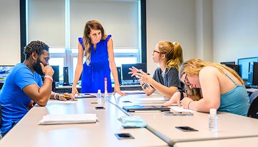 Students in a classroom discussion with instructor